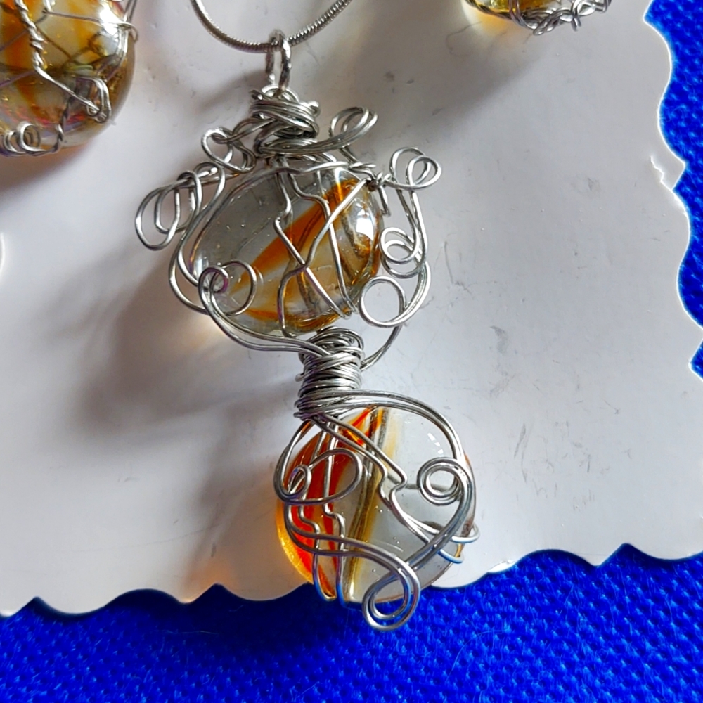 Necklace is 22 inch chain silver glass stones wired in sterling silver wire